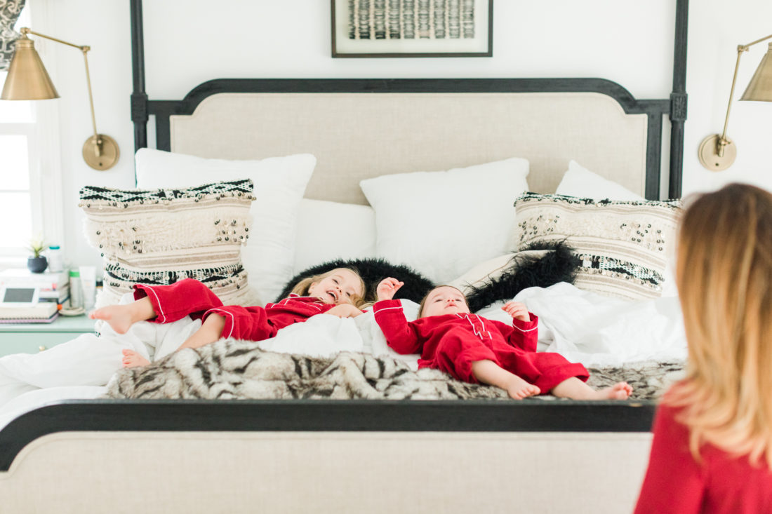 Marlowe and Major fall back in to the Master bed at home in Connecticut wearing matching red pajamas for Valentine's Day