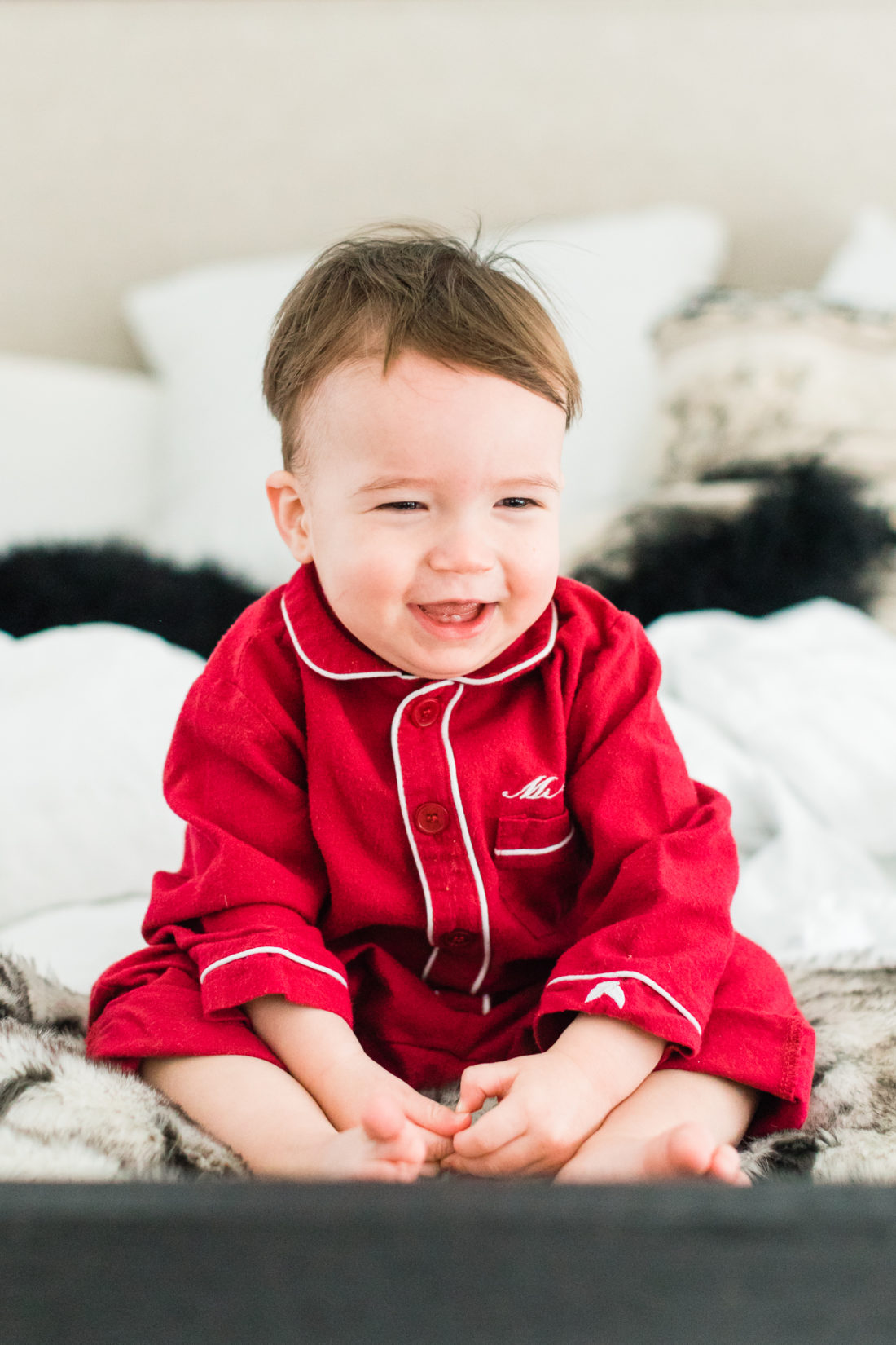 Major Martino laughs in bed at home in Connecticut wearing red flannel pajamas for Valentine's day