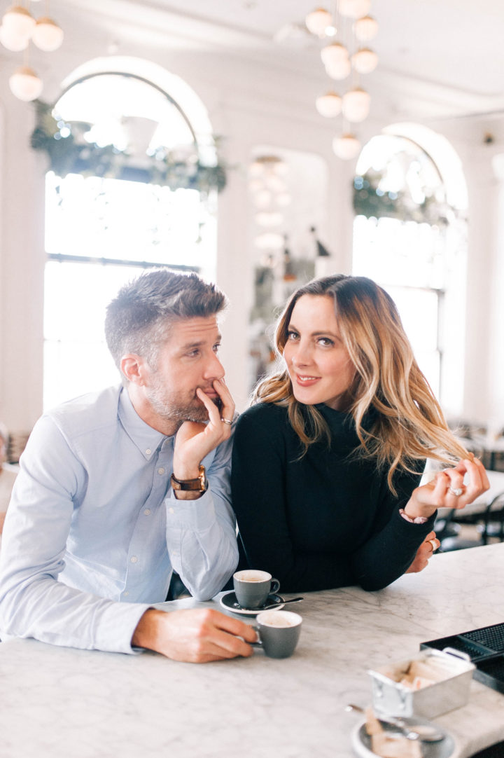 Kyle Martino stares lovingly into his wife Eva Amurri Martino while she plays with her hair at a restaurant