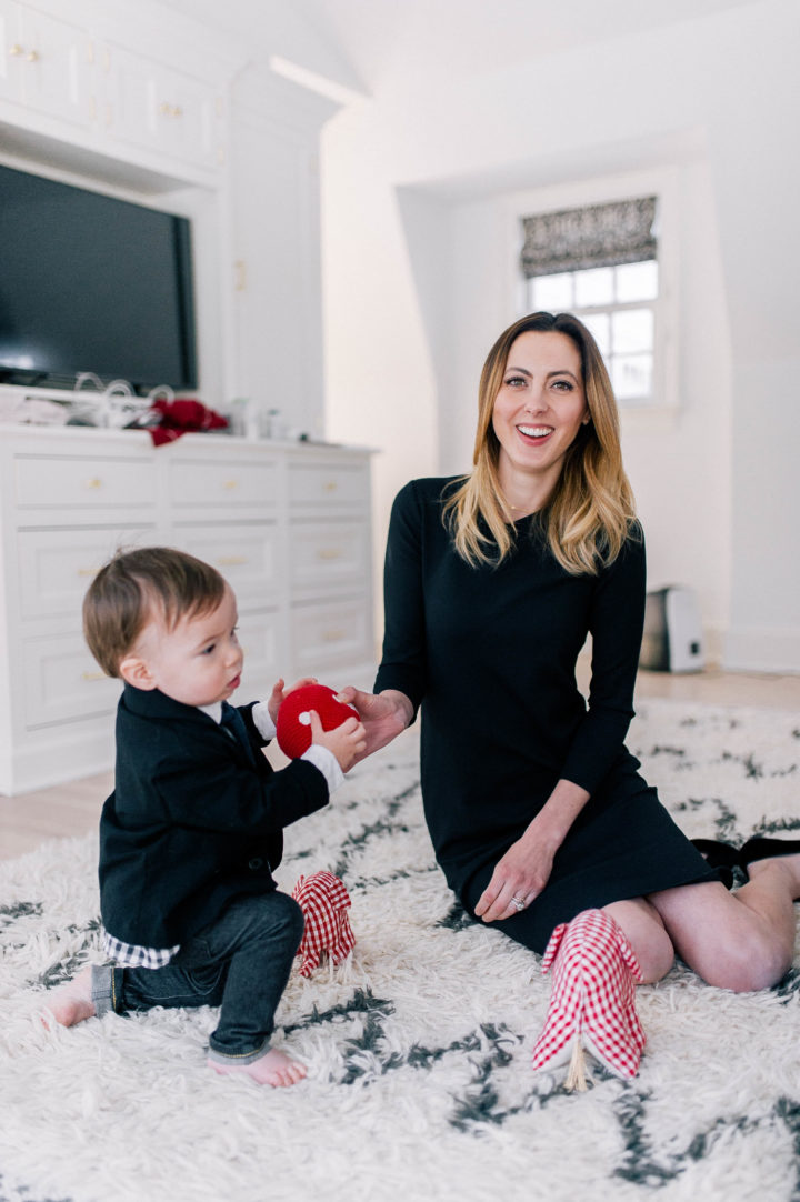 Eva Amurri Martino plays on the floor of her bedroom with her son Major James in a black dress.