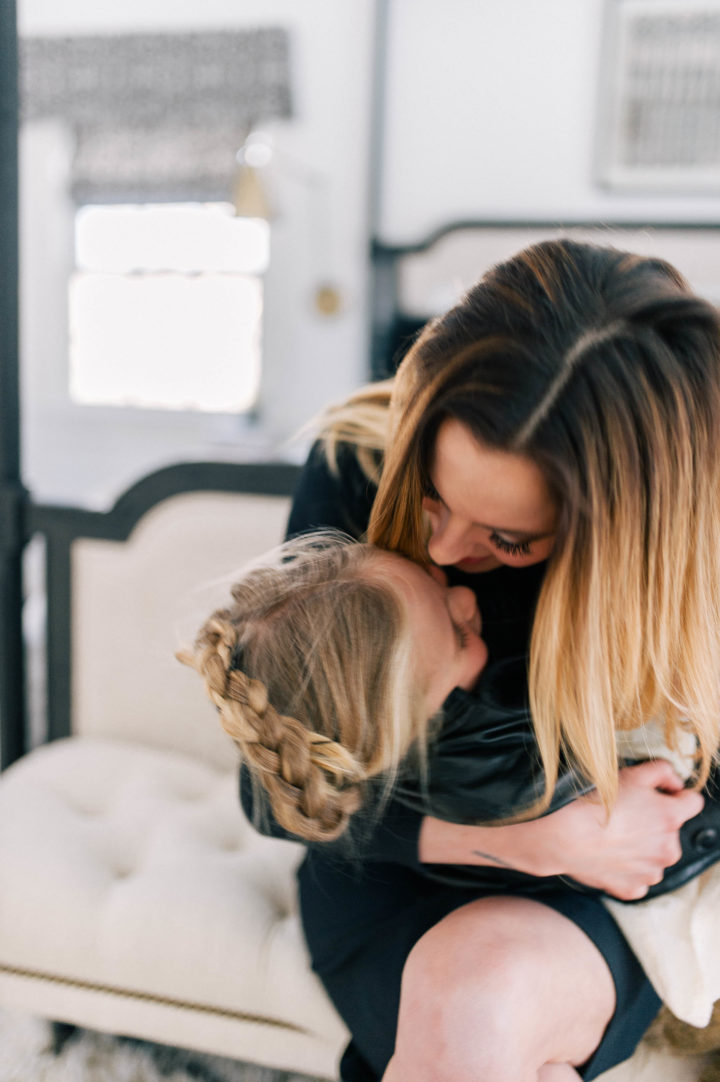 Eva Amurri Martino gives her daughter Marlowe Mae a big kiss on the forehead in their Connecticut home.