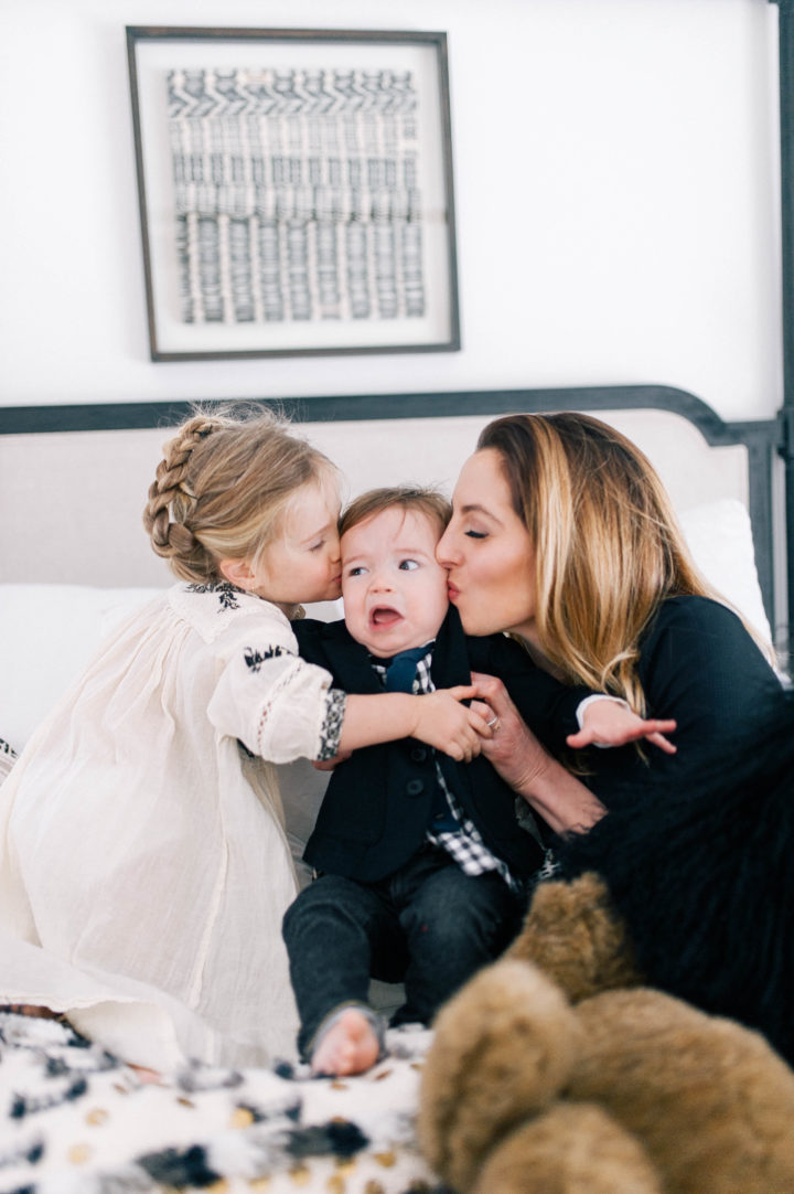 Eva Amurri Martino and her daughter Marlowe Mae Martino kissing son Major James Martino on the bed in their Connecticut home.