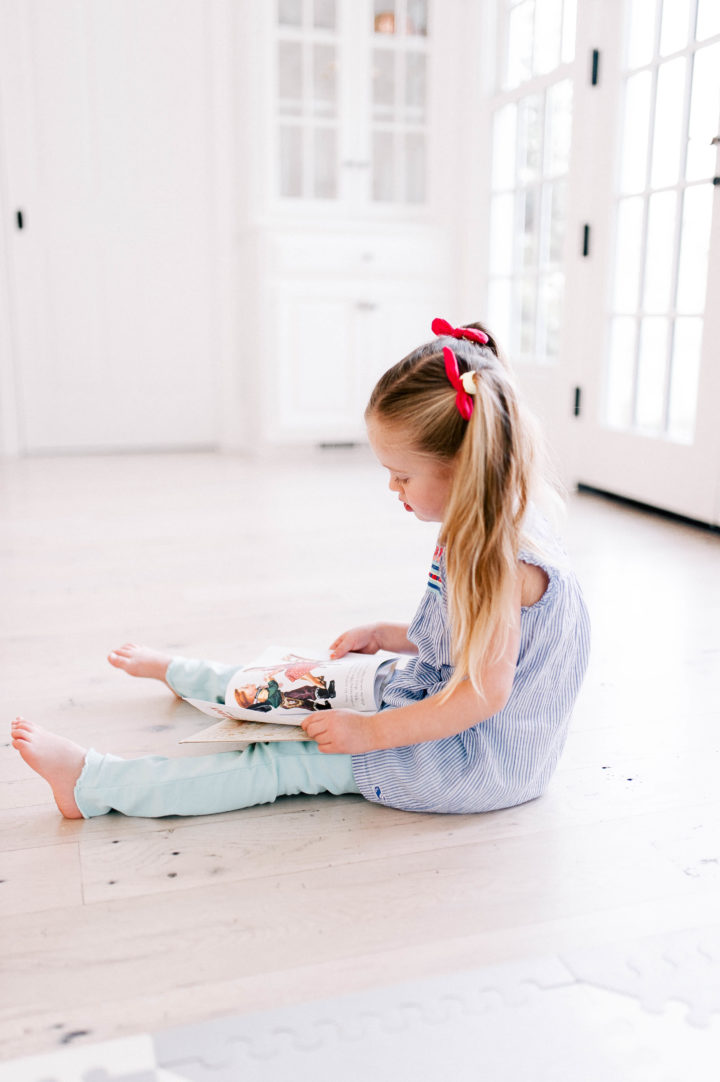 Eva Amurri's daughter Marlowe reads one of her favorite kids' book on the kitchen floor of her Connecticut home.