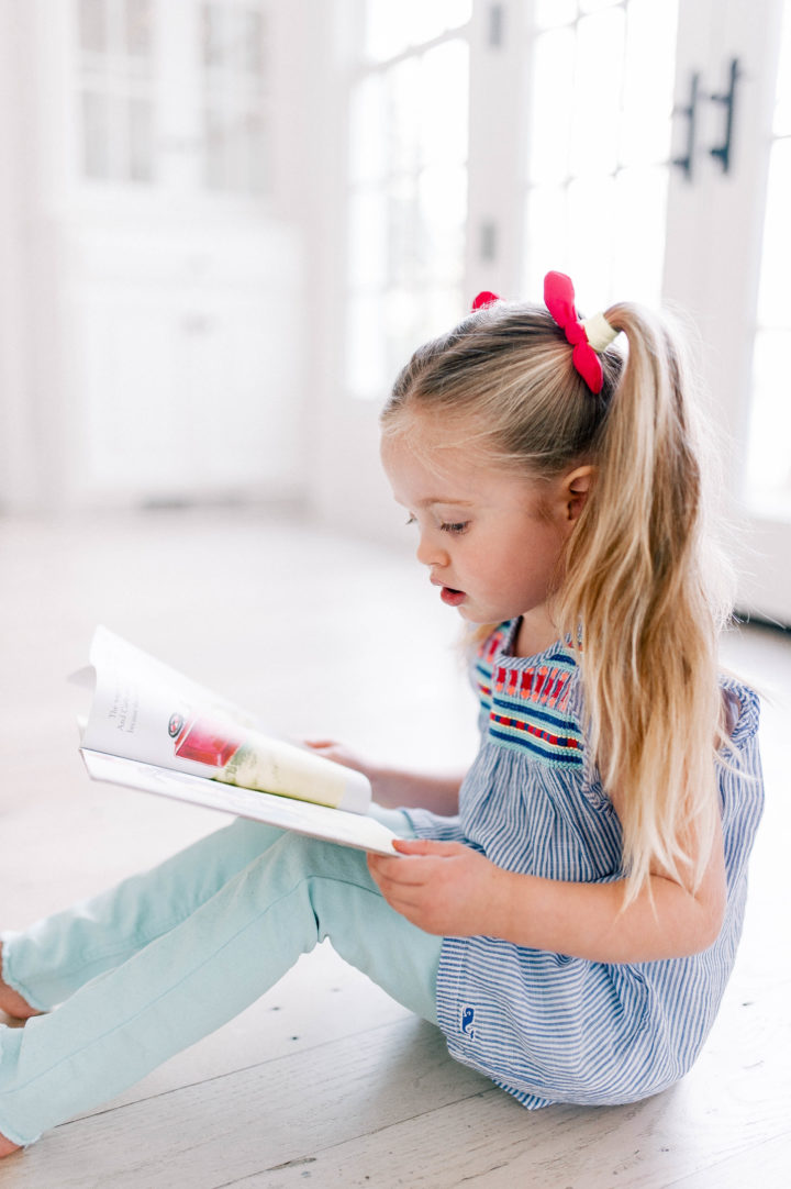 Eva Amurri's daughter Marlowe reads one of her favorite kids' book on the kitchen floor of her Connecticut home.