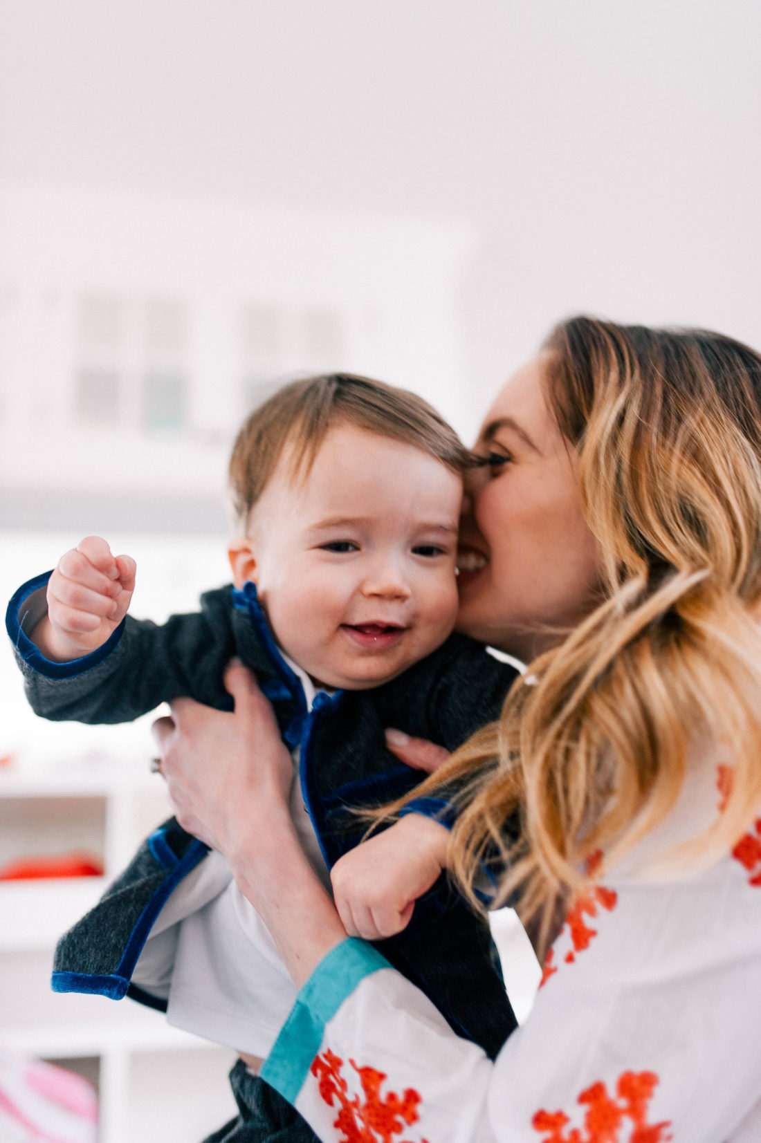Eva Amurri Martino kisses and snuggles one year old son Major James in the family room of their Connecticut home