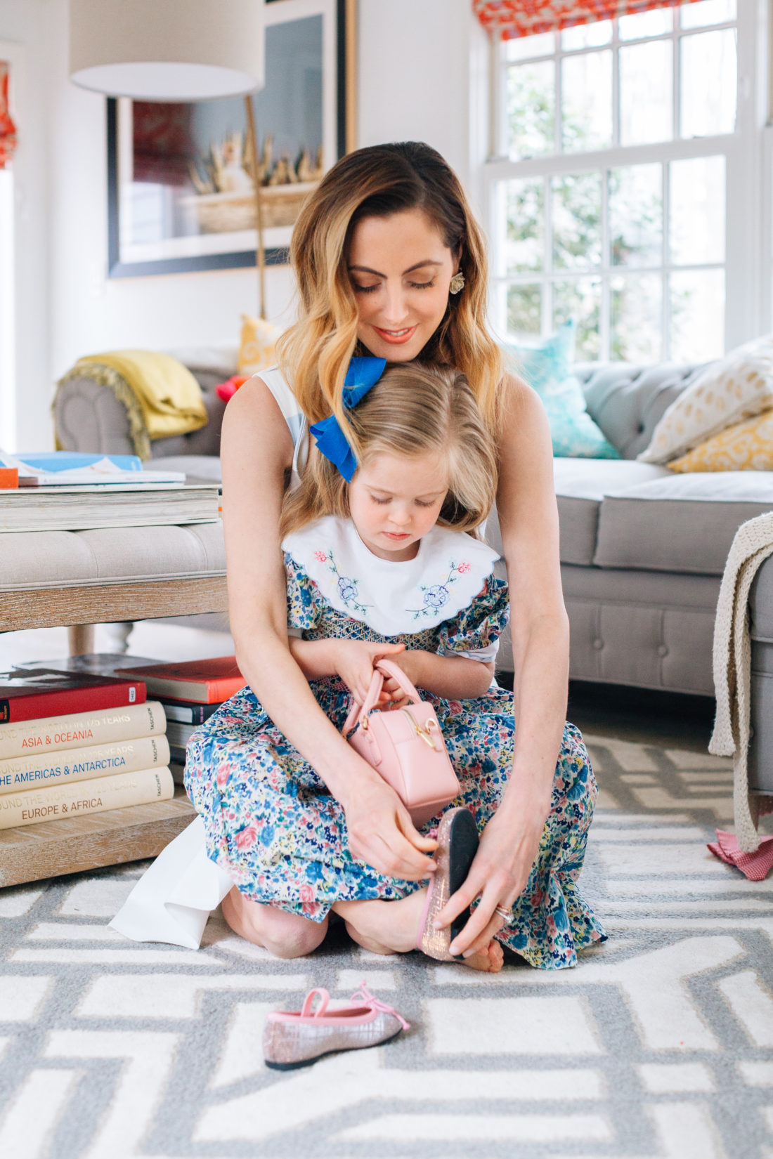 Eva Amurri Martino puts daughter Marlowe's shoes on as they prepare for Easter Sunday