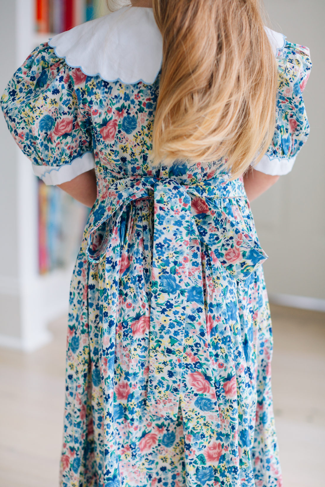 A bow detail shot of the back of Marlowe Martino's vintage floral Easter Dress