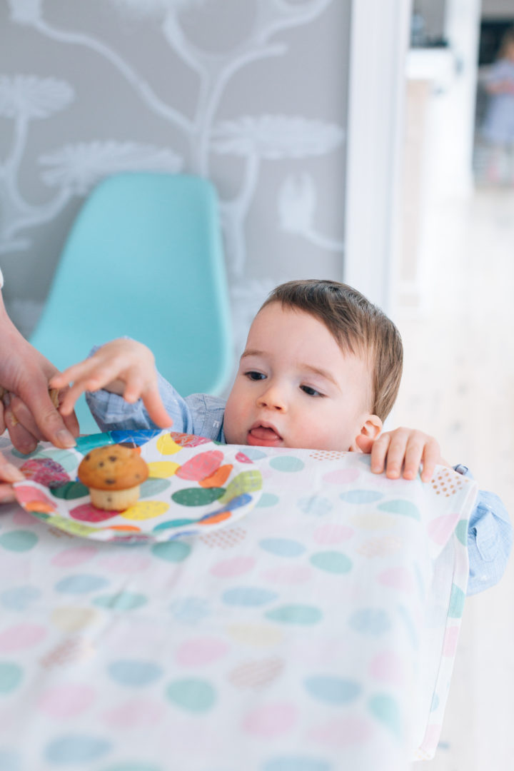 Major Martino reaches for a muffin on the table