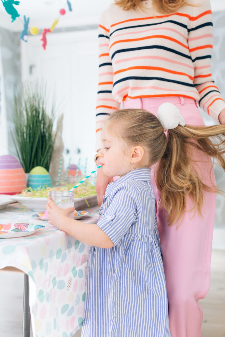 Eva Amurri Martino plays with daughter Marlow's hair while she drinks a pink lemonade at her annual Easter Egg Hunt