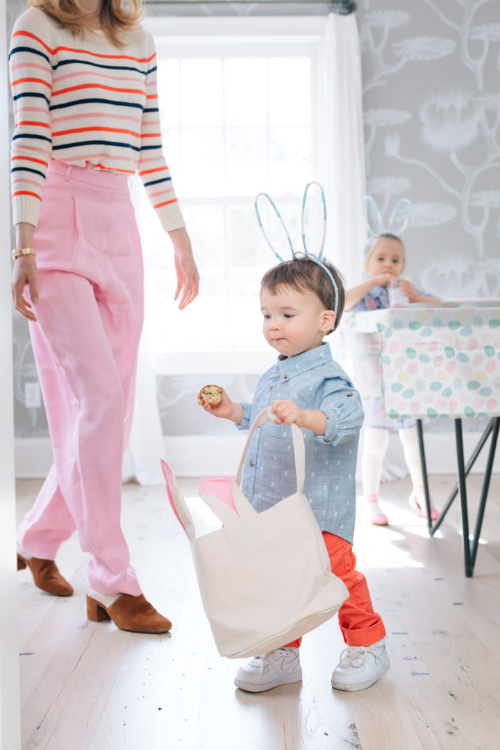 Major Martino finding eggs around the house during his family's annual Easter Egg Hunt at their home in Connecticut.