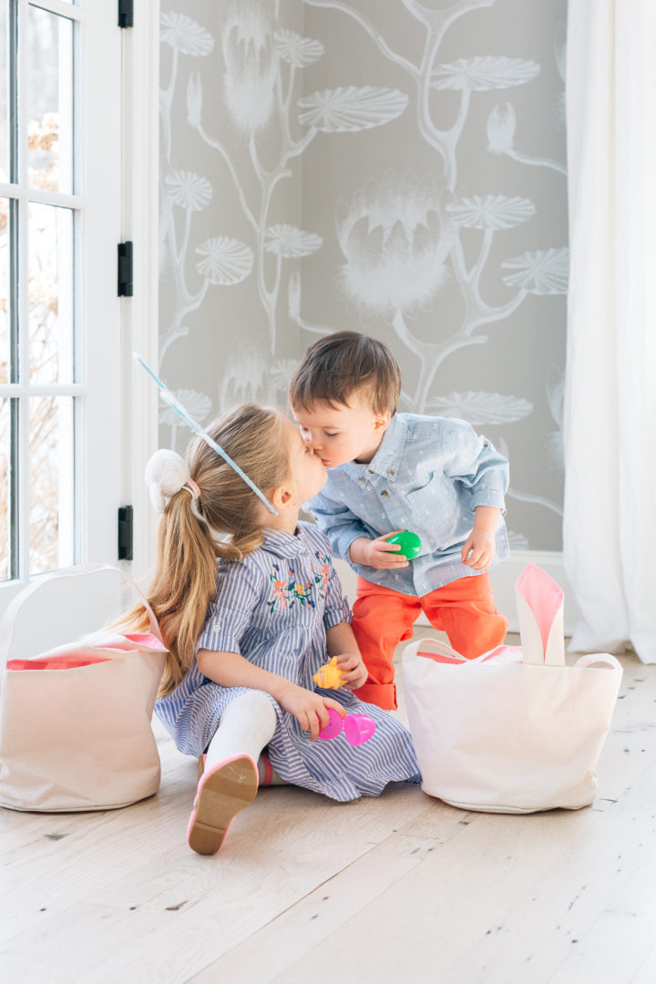 Siblings Marlowe and Major Martino give a sweet kiss to each other at their family's The Easter decorations at Eva Amurri Martino's annual Easter Egg Hunt at her home in Connecticut