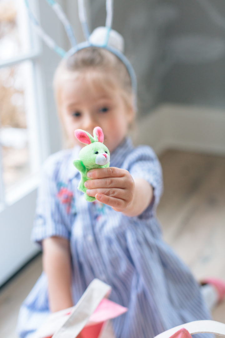 Marlowe Martino finds a toy inside of an easter egg at her family's annual Easter Egg Hunt at their home in Connecticut