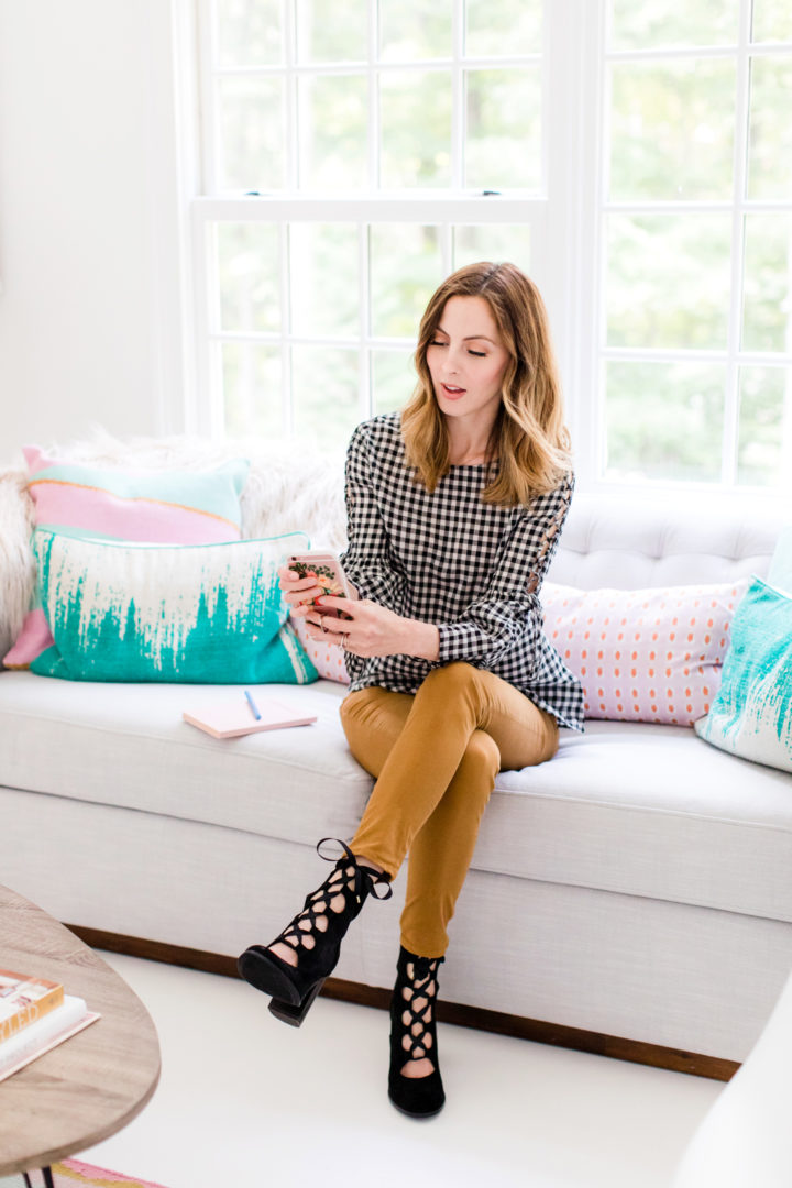 Eva Amurri Martino scrolls through her cell phone while she sits in the Happily Eva After studio in Connecticut