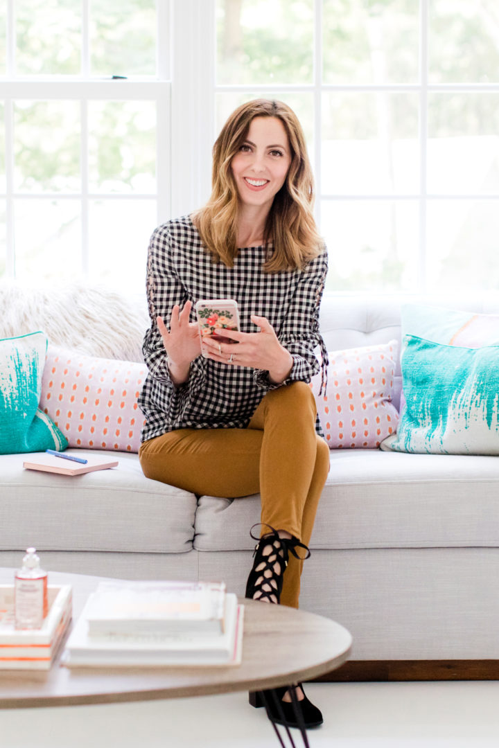 Eva Amurri Martino scrolls through her cell phone while she sits in the Happily Eva After studio in Connecticut