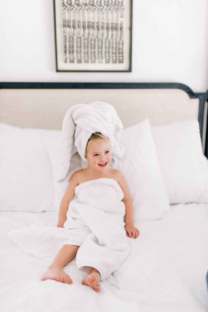 Eva Amurri Martino's daughter Marlowe makes a silly face while she lies in bed with a towel in her hair