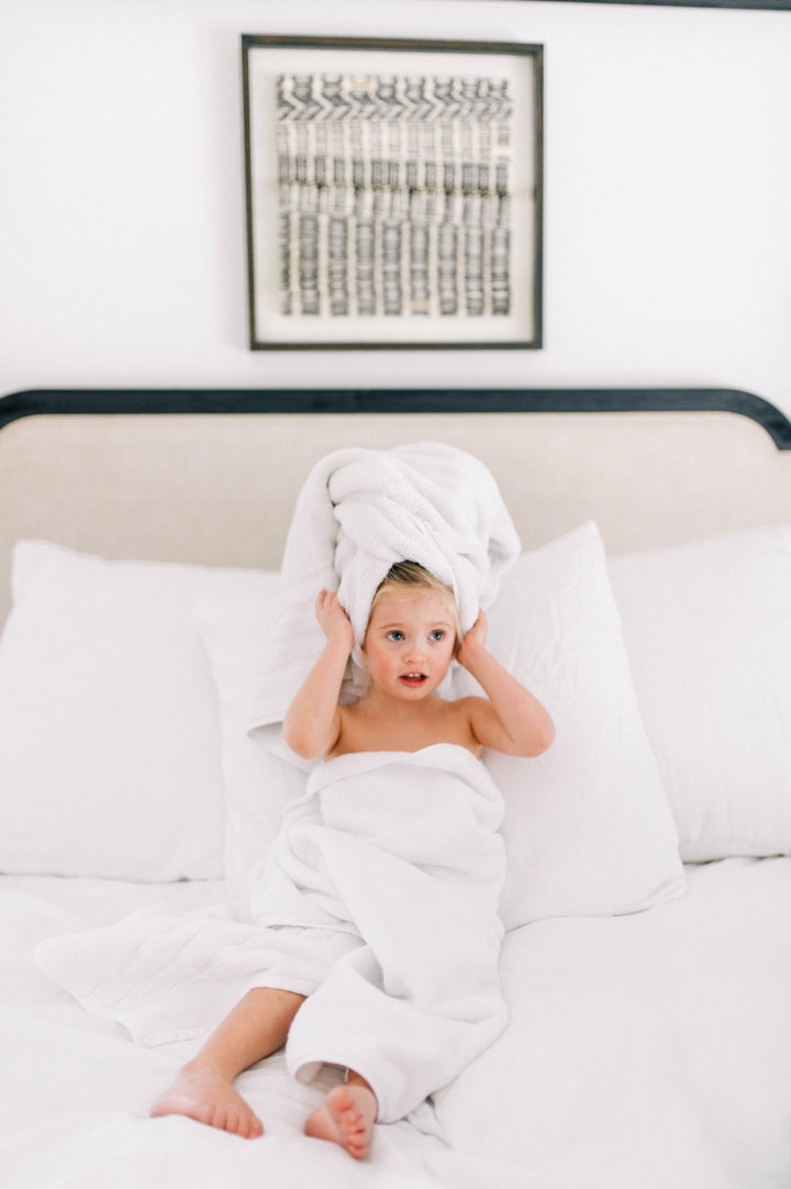 Eva Amurri Martino's daughter Marlowe makes a silly face while she lies in bed with a towel in her hair