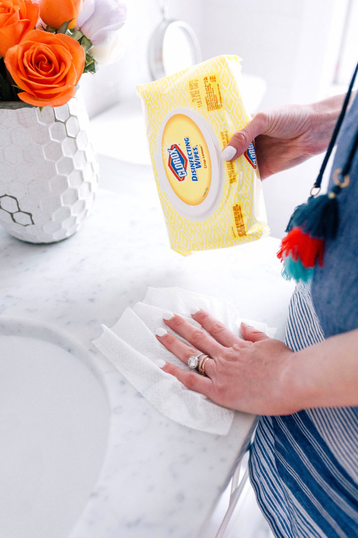Eva Amurri Martino using Clorox wipes to clean her bathroom countertop