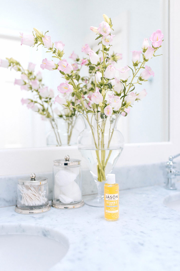 Jason Vitamin E Oil Lotion in Eva Amurri Martino's white marble bathroom in Connecticut