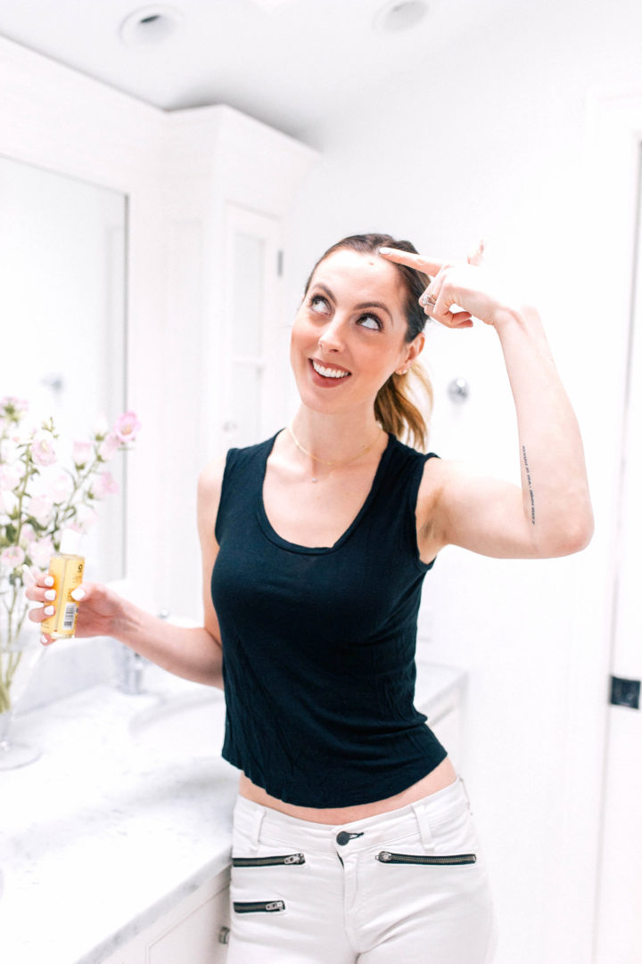 Eva Amurri Martino points jokingly at a scar on her forehead.