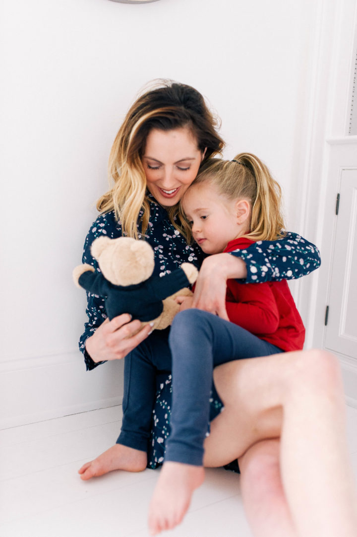 Eva Amurri Martino cradles her daughter Marlowe while holding a teddy bear