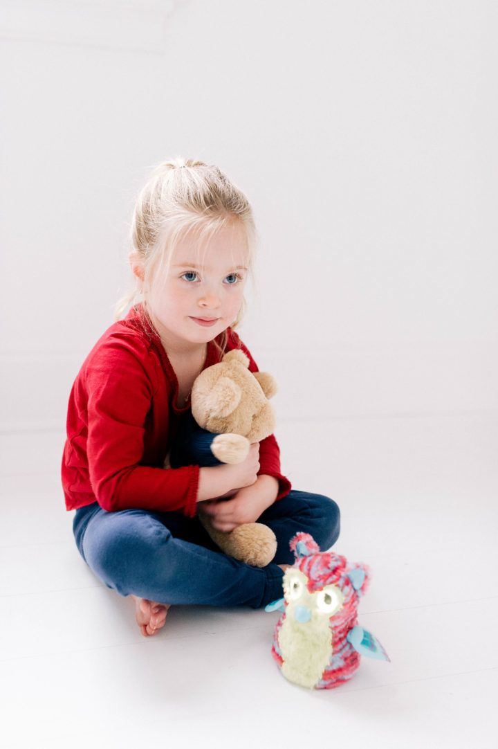 Marlowe Martino cradling a teddy bear