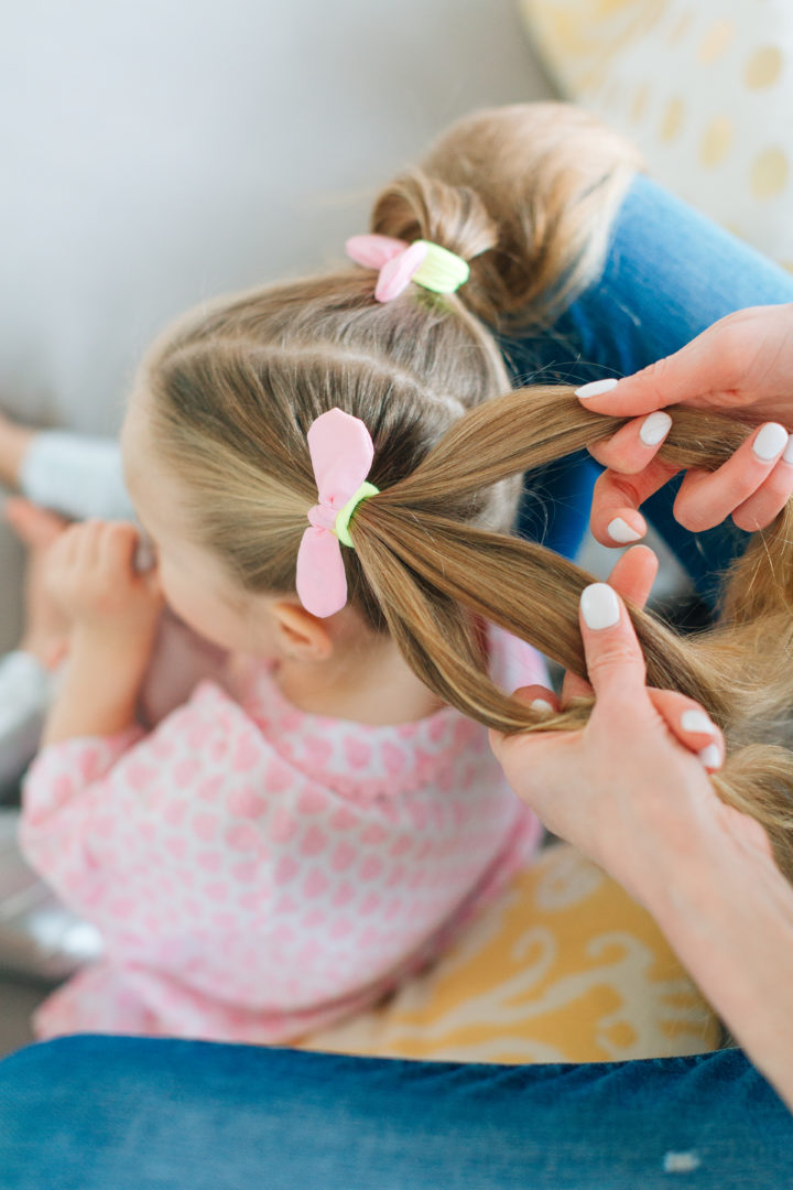 Eva Amurri Martino puts her daughter Marlowe's hair into two Pigtail Braids secured with pink bows.