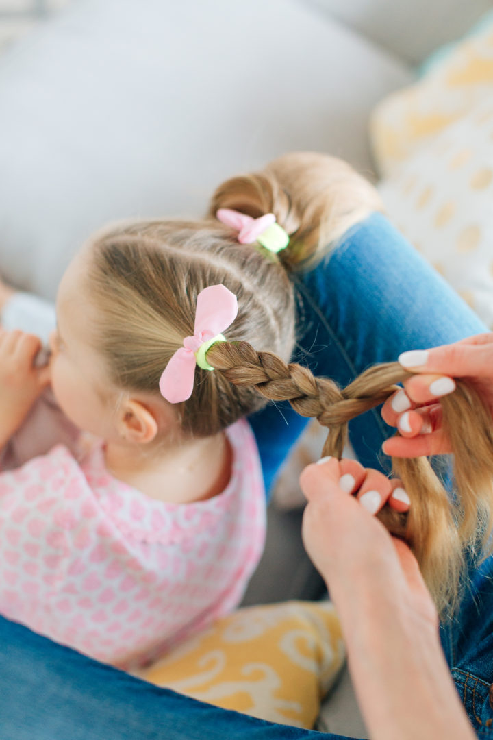 Eva Amurri Martino puts her daughter Marlowe's hair into two Pigtail Braids secured with pink bows.