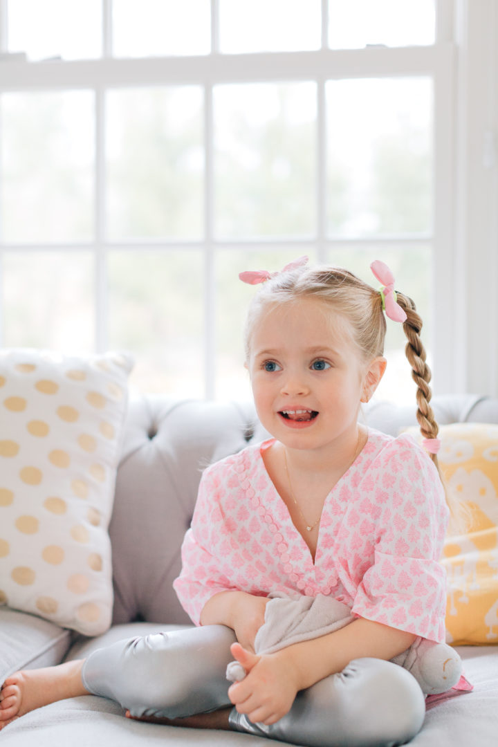 Marlowe Martino shows off her double braided hairstyle on the couch in her Connecticut home.