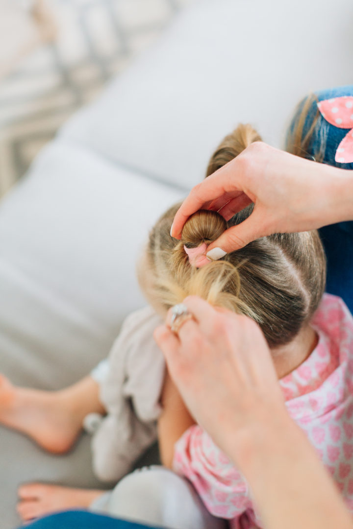 Eva Amurri Martino puts her daughter Marlowe's hair into two twisted knots secured with pink polka dot hairties.