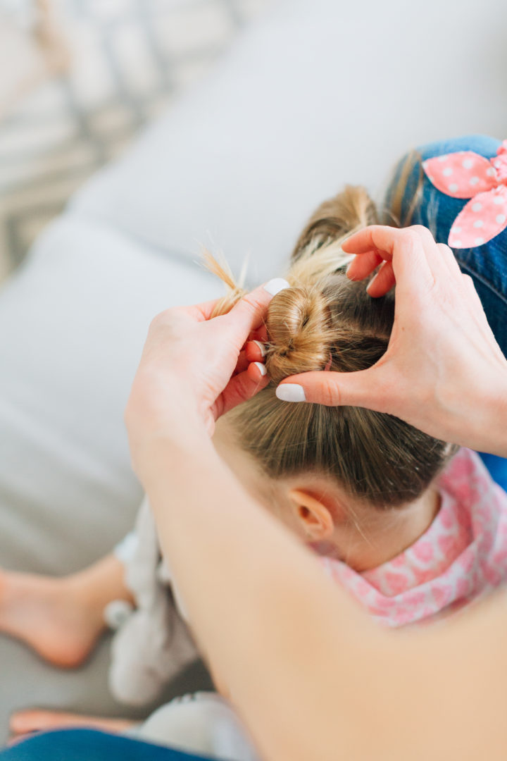 Eva Amurri Martino puts her daughter Marlowe's hair into two twisted knots secured with pink polka dot hairties.