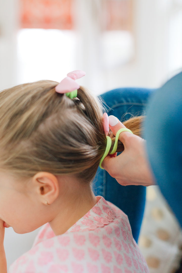 Marlowe Martino shows off her Two Bunch Ponytail secured with pink bows.