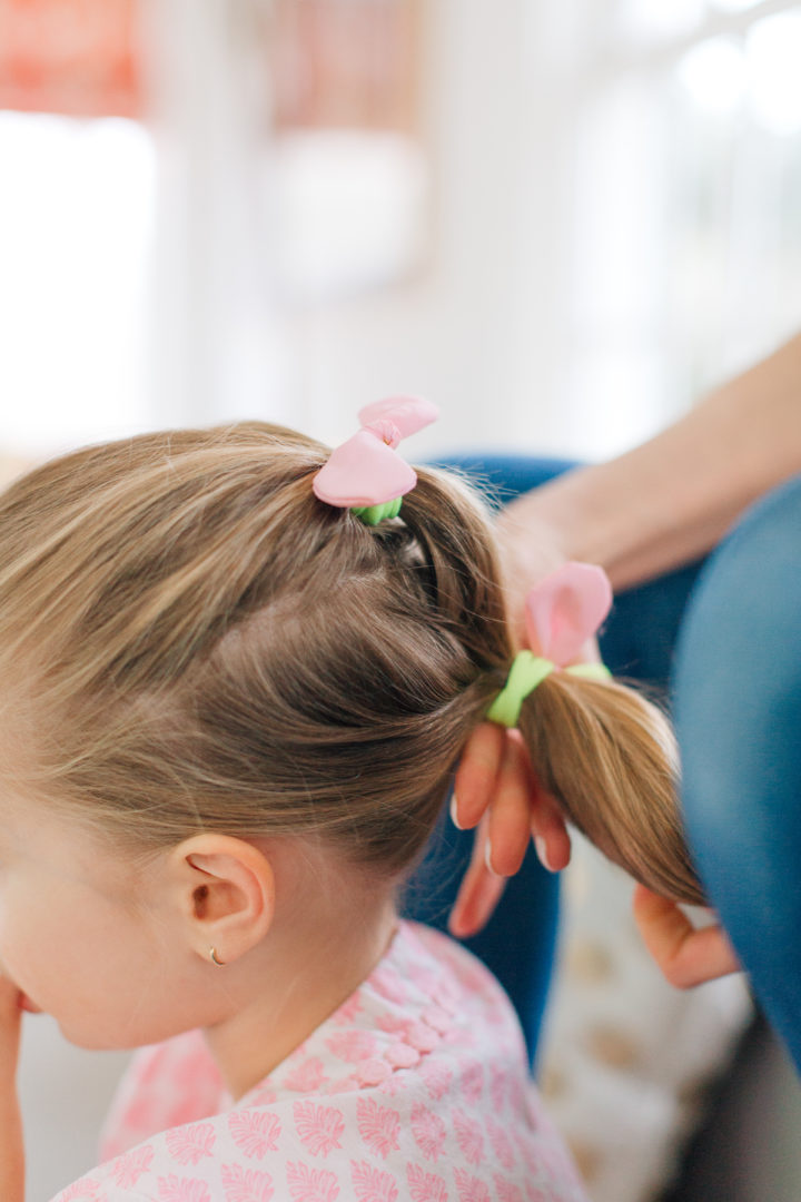 Marlowe Martino shows off her Two Bunch Ponytail secured with pink bows and yellow hair tie.