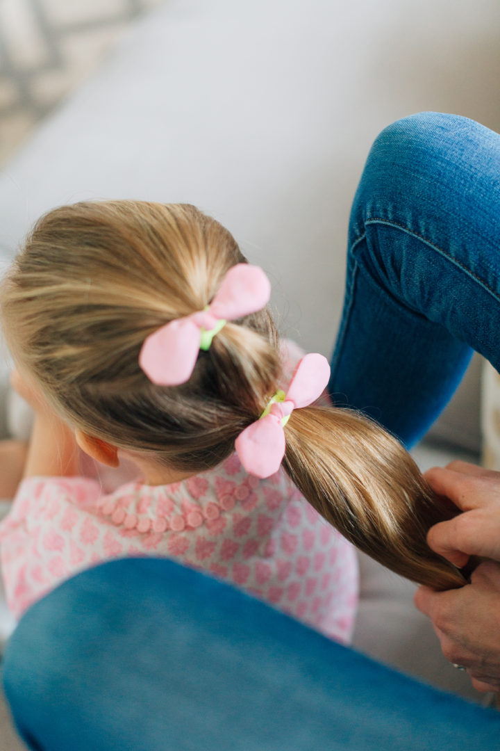 Marlowe Martino shows off her Two Bunch Ponytail secured with pink bows.