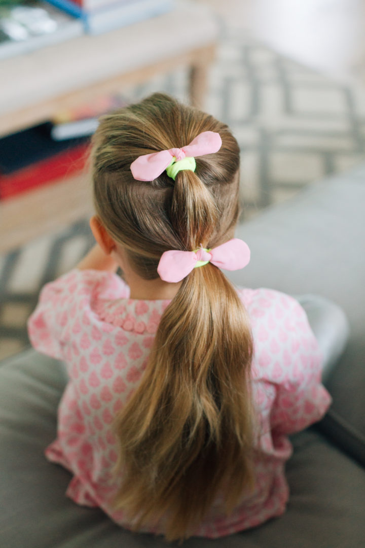 Marlowe Martino shows off her Two Bunch Ponytail secured with pink bows.