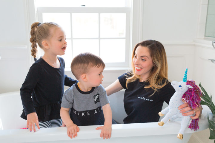 Eva Amurri Martino smiles while she sits in the bathtub with her daughter Marlowe and son Major