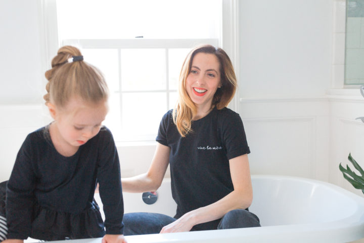 Eva Amurri Martino smiles as she sits in her bathtub with daughter Marlowe