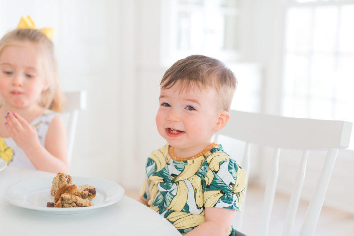 Eva Amurri Martino's son Major smiles with a slice of dairy free banana bread