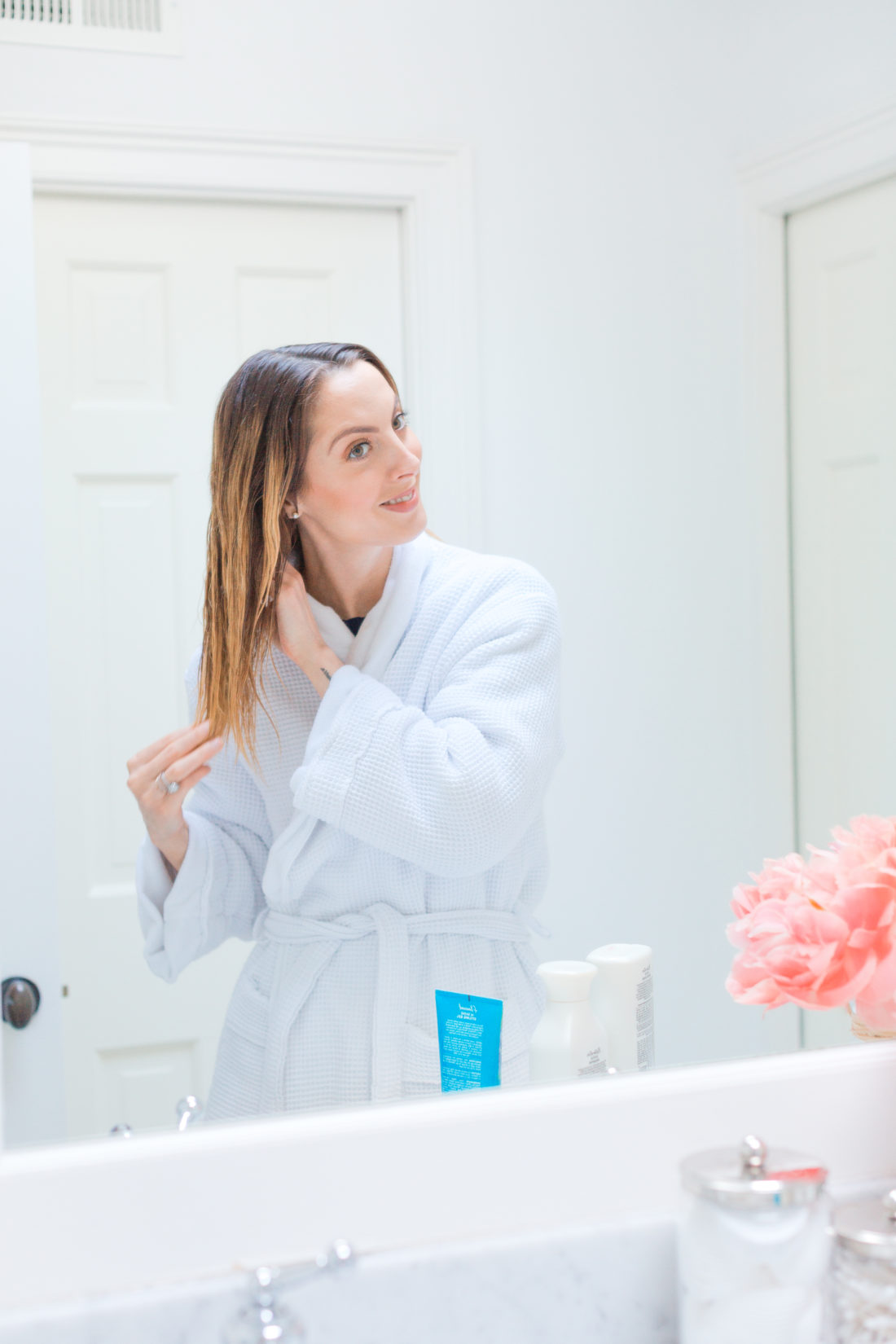 Eva Amurri Martino combs through her wet hair post-shower