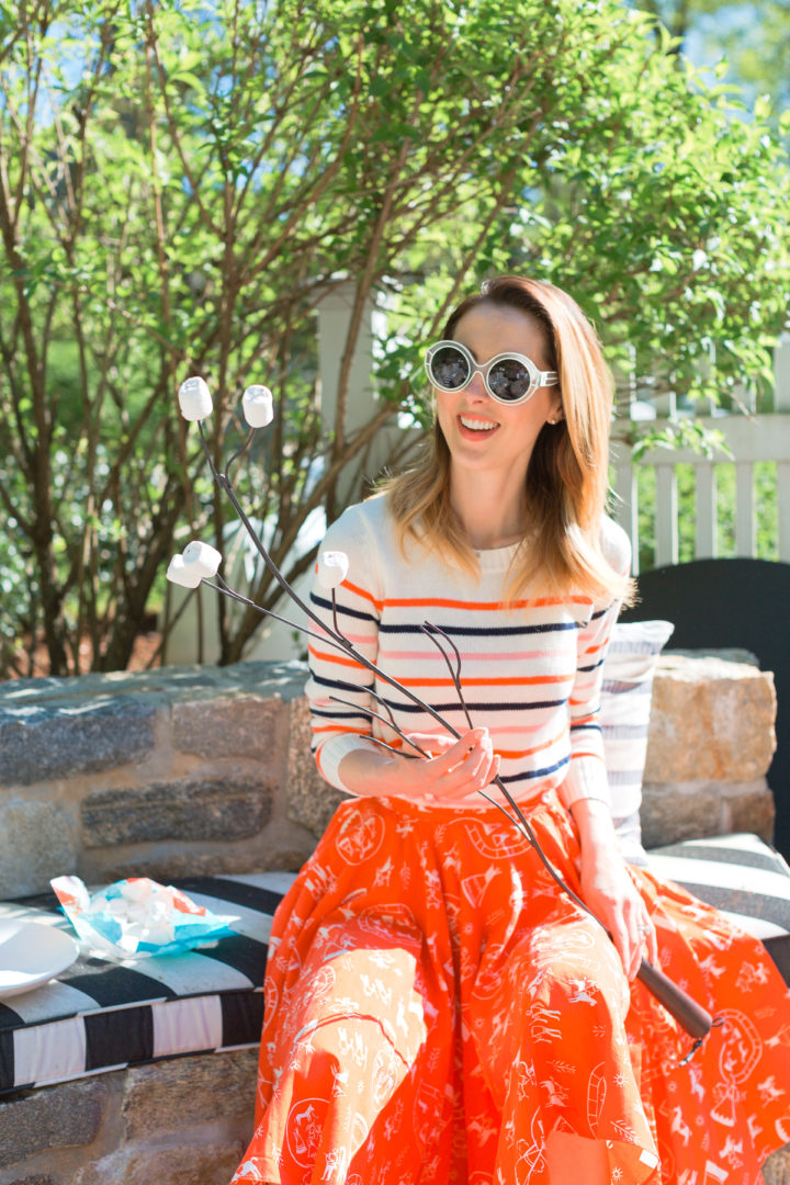 Eva Amurri Martino roasts marshmallows in a colorful frock at her Connecticut home