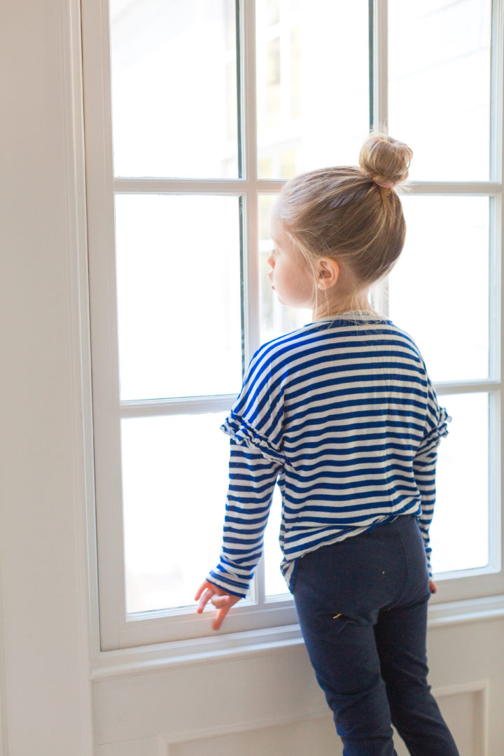 Eva Amurri Martino's daughter Marlowe looks longingly out the window of their Connecticut home