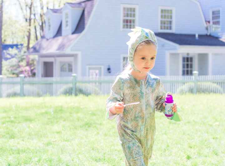 Eva Amurri Martino's daughter Marlowe wars a dinosaur costume and carries bubbles