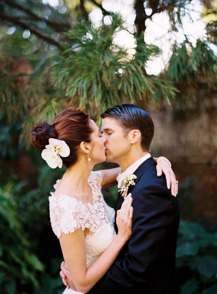 Kyle and Eva Martino kiss sweetly at their Charleston wedding