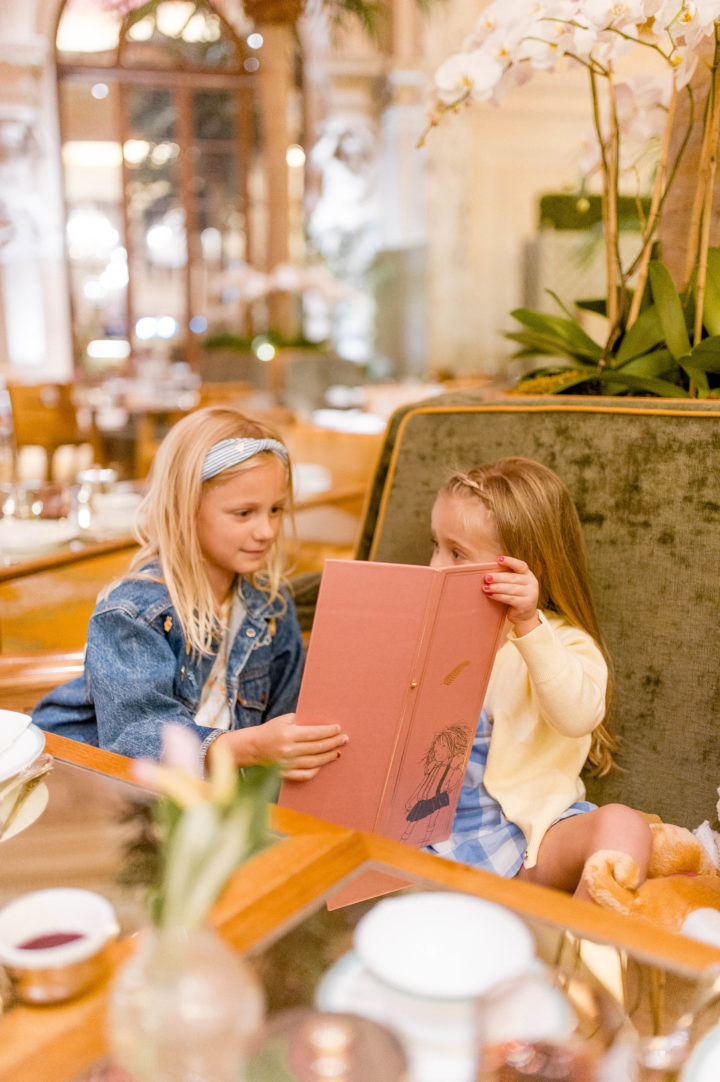 Eva Amurri Martino's daughter Marlowe looks at the menu at the Plaza Hotel in New York City