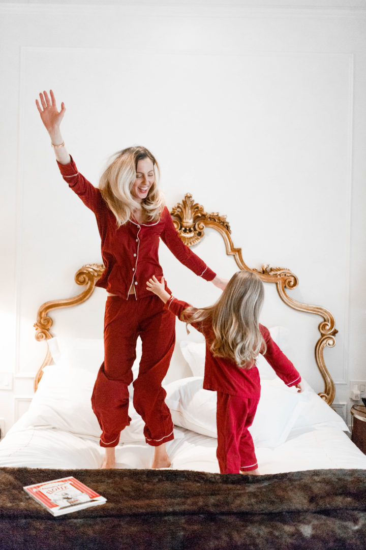 Eva Amurri Martino jumps on the bed at the Plaza Hotel in New York City with her daughter Marlowe