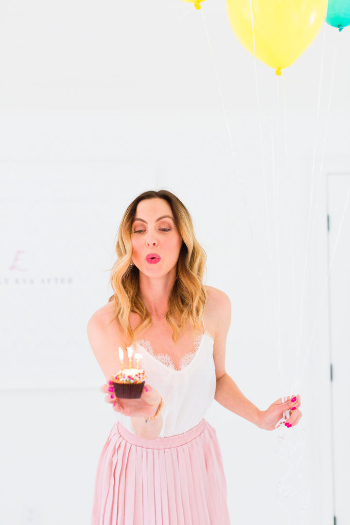 Eva Amurri Martino blows out the candles on a cupcake commemorating the 3rd birthday of her blog, Happily Eva After