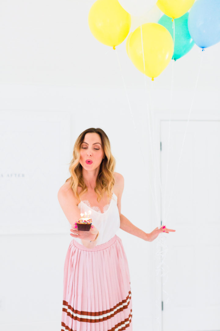 Eva Amurri Martino blows out the candles on a cupcake commemorating the 3rd birthday of her blog, Happily Eva After