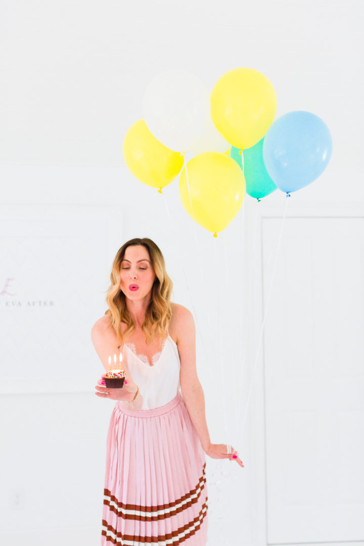 Eva Amurri Martino blows out the candles on a cupcake commemorating the 3rd birthday of her blog, Happily Eva After
