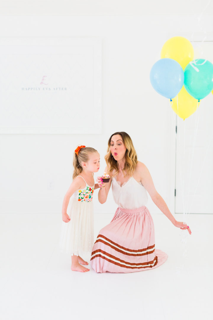 Eva Amurri Martino blows out a candle on a cupcake with her daughter Marlowe to celebrate her blog Happily Eva After's 3rd birthday