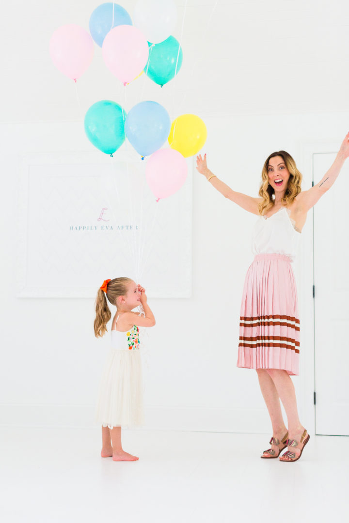 Eva Amurri Martino throws her hands in the air to celebrate the 3rd birthday of her blog Happily Eva After