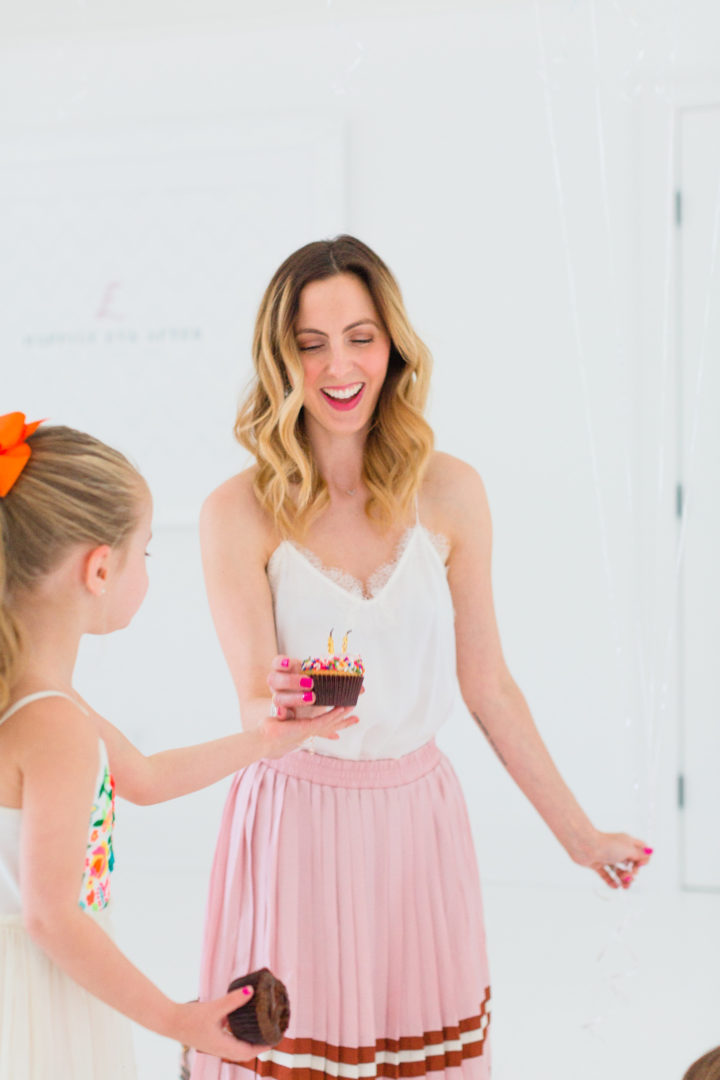 Eva Amurri Martino blows out a candle on a cupcake with her daughter Marlowe to celebrate her blog Happily Eva After's 3rd birthday